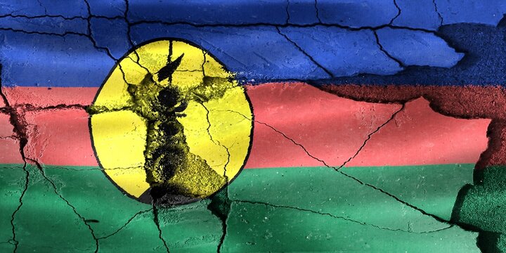 New Caledonia flag showing cracks representing crisis