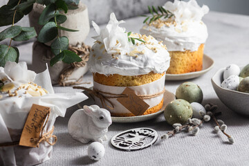 Traditional Easter cakes and painted eggs in white colors .Easter Kulich	
