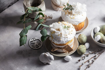 Traditional Easter cakes and painted eggs in white colors .Easter Kulich	