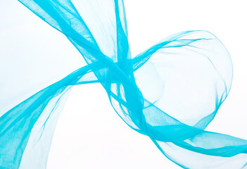 Transparent light blue fabric draped in waves