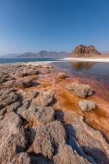 Lake urmia changing colors with salt crust and mountains