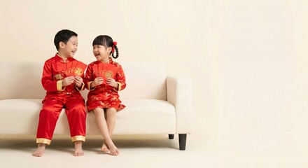 Asian family of four sitting at a table for a reunion dinner and toasting