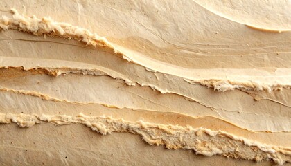 Abstract texture of light brown paint strokes.