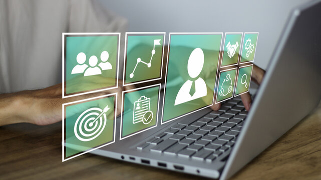 HR, Human Resource and Outsourcing concept showing an HR manager using innovative recruitment employee tools on a laptop to manage digital talent, workforce goals, and corporate hiring strategies