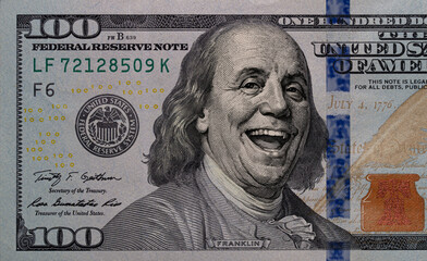 Benjamin Franklin smiling on 100 dollar banknote