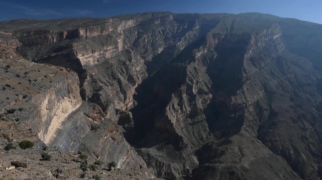 Rock formations of Wadi Ghul aka Grand Canyon of Arabia in Jebel Shams, Oman
