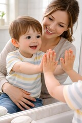 Curious child touching mirror reflection while sitting safely on mother lap