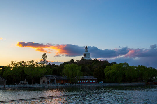 White Dagoba lakeside sunset glow at Beihai Park, Beijing, China