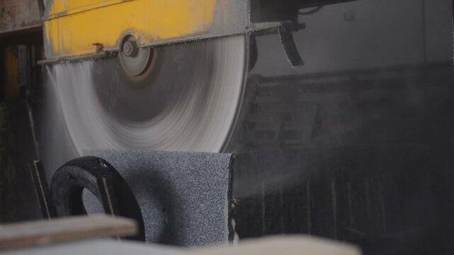a special machine cutting a granite slab