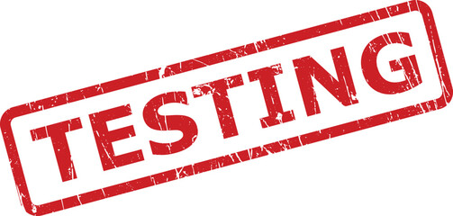 The word TESTING appears on a vibrant red rubber stamp with a grunge texture over a white background