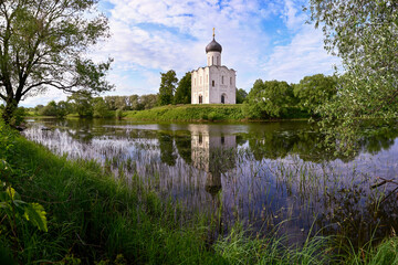 Evening lake reflection of the Church of the Intercession on the Nerl in Bogolyubovo, Vladimir region of Russia