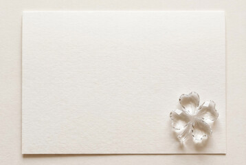 Elegant blank white paper card with crystal four leaf clover decoration for Saint Patrick day greeting 