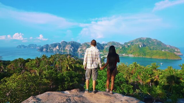 Woman enjoying breathtaking view of stunning phi phi island surrounded by crystal clear waters