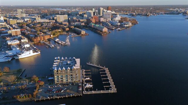 Aerial view of downtown Norfolk waterfront marina and skyline on Elizabeth River with calm reflections