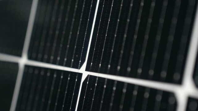 Macro Texture of Polycrystalline Silicon Solar Cell showing Photovoltaic Wafer Grid and Sun Flare Reflection for Clean Energy Technology