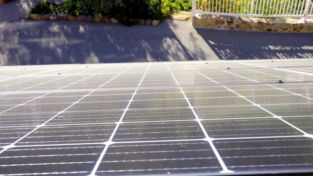 Macro Texture of Polycrystalline Silicon Solar Cell showing Photovoltaic Wafer Grid and Sun Flare Reflection for Clean Energy Technology