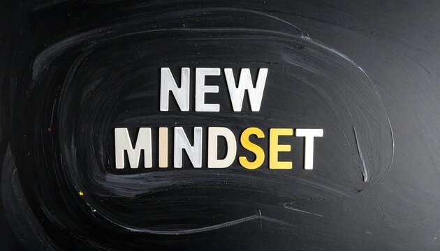 New Mindset Text on Dark Chalkboard Background.