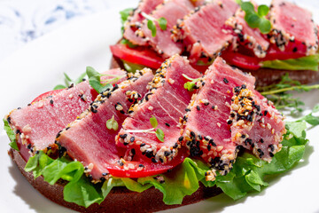 Breakfast, sandwiches, fried tuna fillet, in sesame seeds, no people, top view, homemade, © DideBashvili