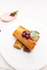 Sweet Stuffed Crepes with Cherries and Powdered Sugar