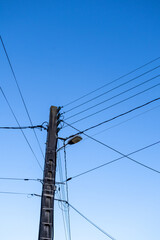 Fototapeta premium high voltage power lines against blue sky