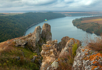 Breathtaking panoramic view of the Dniester River and Shyshkovi Horby hills in Nagoryany, Ukraine. High angle aerial view of the picturesque Dniester canyon with unique limestone rock formations .