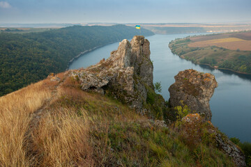 Breathtaking panoramic view of the Dniester River and Shyshkovi Horby hills in Nagoryany, Ukraine. High angle aerial view of the picturesque Dniester canyon with unique limestone rock formations .