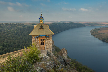 Breathtaking panoramic view of the Dniester River and Shyshkovi Horby hills in Nagoryany, Ukraine. High angle aerial view of the picturesque Dniester canyon with unique limestone rock formations .