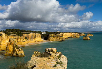 Beautiful natural limestone arch near Praia da Marinha in Lagoa, Portugal