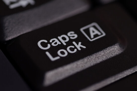 Keyboard key labeled Caps Lock with square "A" icon, symbolizing uppercase input in computing.