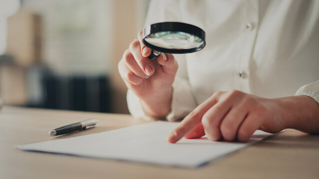 Examining documents with a magnifying glass
