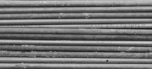 Steel rods as background, black and white photo