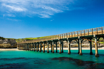 Pier On Santa Rosa Island Juts Outs Into Teal Water Of The Pacific