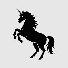 Obraz premium Black silhouette of a rearing unicorn with a spiral horn, mane, and tail, on a light gray background, mythical and magical.