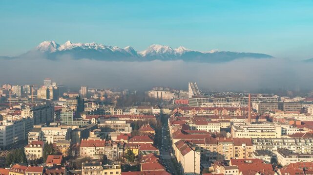Ljubljana Slovenia time lapse city skyline and Kamnik Savinja Alps mountain range