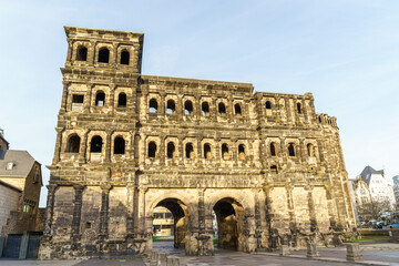 Obraz premium Ancient black Roman gate Porta Nigra in the city of Trier in Germany the sky is clear blue