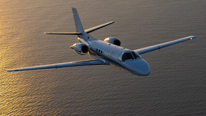 Business jet (Citation Encore ) in beautiful light sunset light, over the Pacific Ocean © ranchorunner