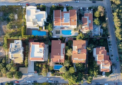 Aerial view of luxury villas with swimming pools in Ano Glyfada, Athens Riviera