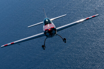 Acrobatic plane  (Extra),  in beautiful light sunset light over the Pacific Ocean © ranchorunner