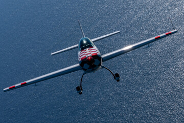 Acrobatic plane  (Extra),  in beautiful light sunset light over the Pacific Ocean © ranchorunner