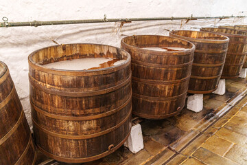 Large wooden barrels of the old type in the cellars of a Czech brewery in the town of Pilsen