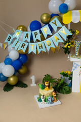 Jungle Safari First Birthday Party Setup with Animal Cake and Balloons