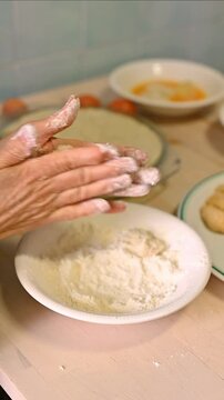 Woman Hands coocking Homemade Spanish Croquettes with Flour , Traditional Recipe Food