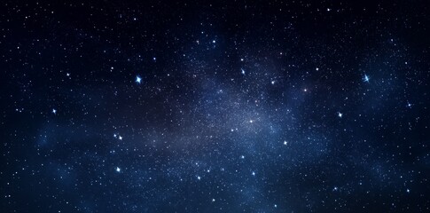 Obraz premium Stunning night sky with countless stars and a visible Milky Way galaxy, creating a breathtaking celestial display.