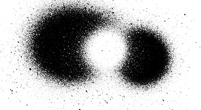 Abstract black spray paint splatters forming a unique shape on white background.