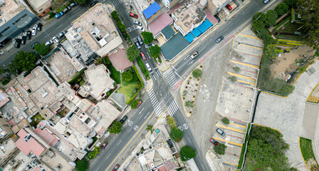 Aerial top view of traffic intersection and city blocks in South America.
