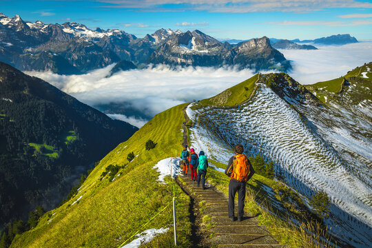 Hiker group on the famous Stoos mountain ridge in Switzerland
