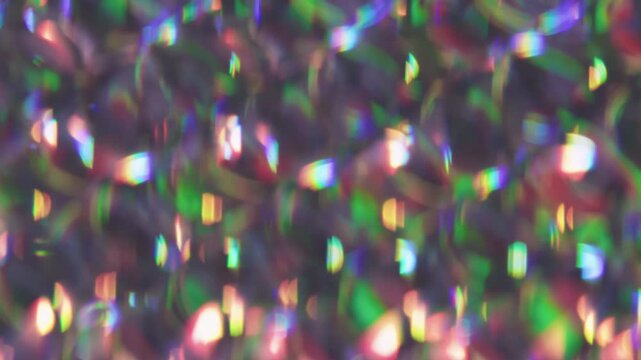 Art kaleidoscope. Colorful light. Defocused purple green pink round reflection gleam bright texture leak on abstract dazzle background.