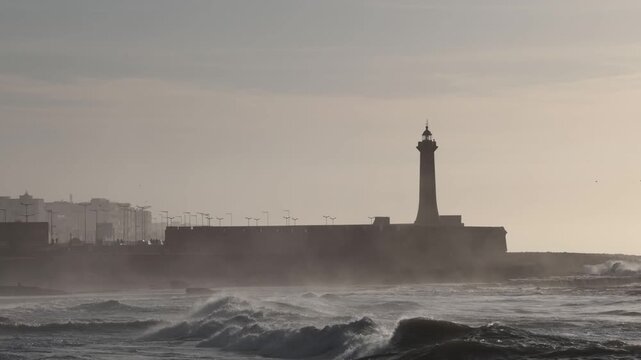 Rabat, Morocco Large waves on the Atlantic Ocean roll past the Lighthouse of Rabat. 