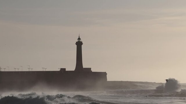Rabat, Morocco Large waves on the Atlantic Ocean roll past the Lighthouse of Rabat. 