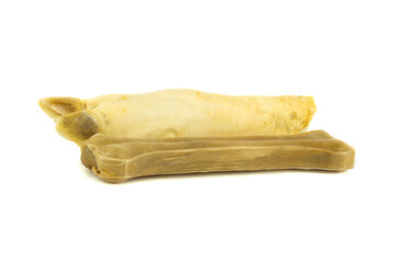 Pig hoof and dog bone on a white background